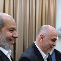 Hamas political bureau chief Khalil al-Hayya, left, seen in Tehran on February 8, 2025. (Photo by KHAMENEI.IR / AFP)