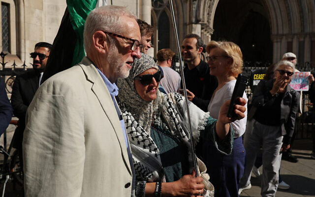 Jeremy Corbyn, left, outside the Royal Courts of Justice in central London on May 13, 2025. (Adrian Dennis / AFP) Jeremy Corbyn, left, outside the Royal Courts of Justice in central London on May 13, 2025. (Adrian Dennis / AFP)