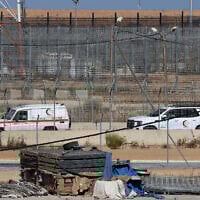 File: Red Crescent ambulances are pictured at the Kerem Shalom crossing between southern Israel and the Gaza Strip, on May 29, 2025 (Jack GUEZ / AFP)