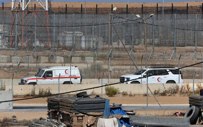 File: Red Crescent ambulances are pictured at the Kerem Shalom crossing between southern Israel and the Gaza Strip, on May 29, 2025 (Jack GUEZ / AFP)