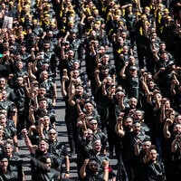 Lebanese Shiite Hezbollah supporters take part in a ceremony during the peak of Ashura, a 10-day period commemorating the seventh century killing of Prophet Mohammed's grandson Imam Hussein, in Beirut's southern suburbs on July 6, 2025. (ANWAR AMRO / AFP)