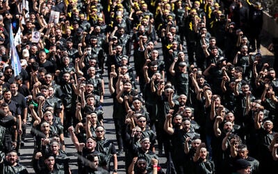 Lebanese Shiite Hezbollah supporters take part in a ceremony during the peak of Ashura, a 10-day period commemorating the seventh century killing of Prophet Mohammed's grandson Imam Hussein, in Beirut's southern suburbs on July 6, 2025. (ANWAR AMRO / AFP) Lebanese Shiite Hezbollah supporters take part in a ceremony during the peak of Ashura, a 10-day period commemorating the seventh century killing of Prophet Mohammed's grandson Imam Hussein, in Beirut's southern suburbs on July 6, 2025. (ANWAR AMRO / AFP)