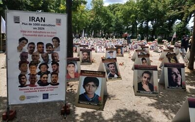Portraits of slain Iranians are displayed in an area of Esplanades des Invalides in Paris, France, on July 8, 2025, as part of a campaign by human rights groups focused on Iran to stop executions in in the Islamic Republic. (Delphine TOUITOU / AFP)