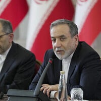 Iranian Foreign Minister Abbas Araghchi (R) meets with ambassadors and diplomatic representatives in Tehran, Iran, on July 12, 2025. (Hamid FOROUTAN / Iran's Ministry of Foreign Affairs / AFP)