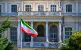 An Iranian flag flutters in front of the Iranian Consulate, where Iranian diplomats meet counterparts from Germany, Britain and France for renewed nuclear talks, in Istanbul, Turkey, on July 25, 2025. (Yasin AKGUL / AFP)
