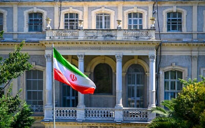 An Iranian flag flutters in front of the Iranian Consulate, where Iranian diplomats meet counterparts from Germany, Britain and France for renewed nuclear talks, in Istanbul, Turkey, on July 25, 2025. (Yasin AKGUL / AFP)