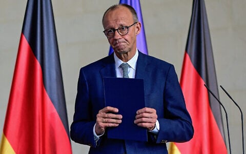 German Chancellor Friedrich Merz leaves after making a statement to journalists following a meeting of the security Cabinet of the German government at the Chancellery in Berlin on July 28, 2025. (John MACDOUGALL / AFP)