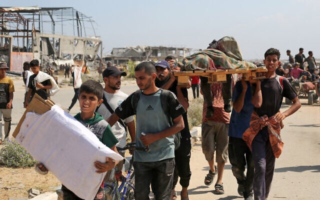 Palestinians carry the body of a man killed while seeking food at a distribution point run by the US- and Israeli-backed Gaza Humanitarian Foundation, near the Nusseirat refugee camp, in the central Gaza Strip on August 2, 2025. (Eyad BABA / AFP) Palestinians carry the body of a man killed while seeking food at a distribution point run by the US- and Israeli-backed Gaza Humanitarian Foundation, near the Nusseirat refugee camp, in the central Gaza Strip on August 2, 2025. (Eyad BABA / AFP)