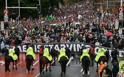 Mounted police keep watch as pro-Palestinian, anti-Israel protesters march towards Sydney's Harbour Bridge during a demonstration on August 3, 2025. (Saeed KHAN / AFP)