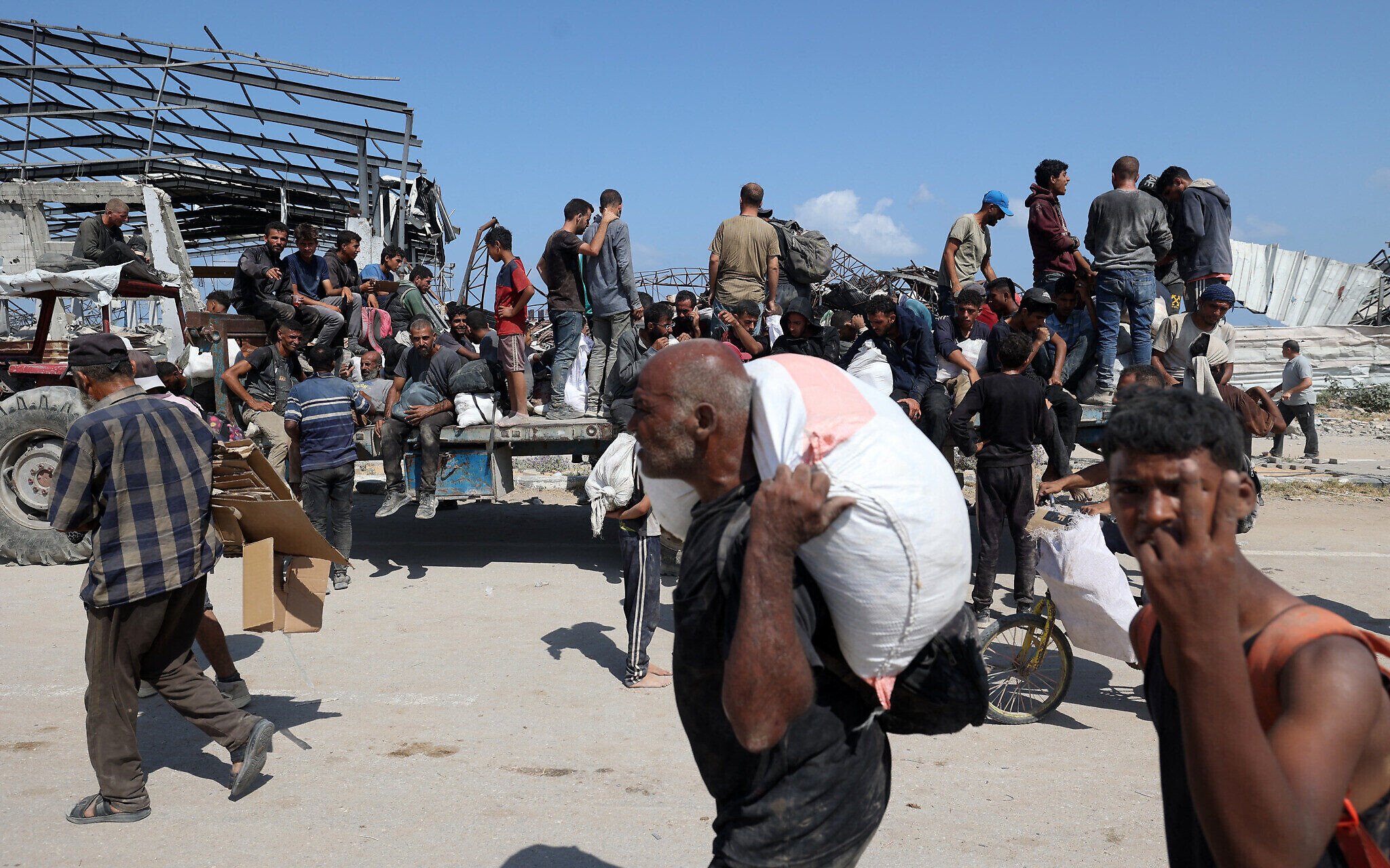 Gaza hospital officials, witnesses say 23 killed seeking aid near GHF sites by Israeli fire