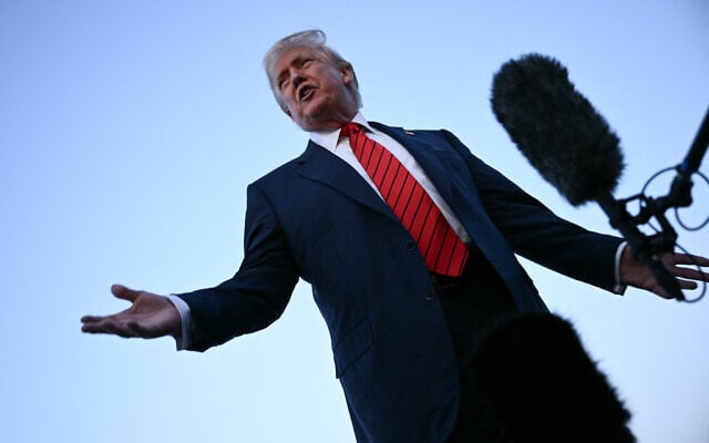 US President Donald Trump speaks to journalists at Lehigh Valley International Airport in Allentown, Pennsylvania, on August 3, 2025, as returns to the White House from his Bedminster residence. (Brendan Smialowski/AFP)