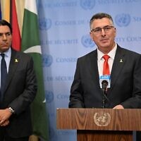 Foreign Minister Gideon Saar speaks to journalists as Israeli Ambassador to the UN Danny Danon looks on, ahead of a United Nations Security Council meeting on the hostages and the Gaza war, at the UN headquarters, on August 5, 2025 in New York. (Photo by Angela Weiss/AFP)