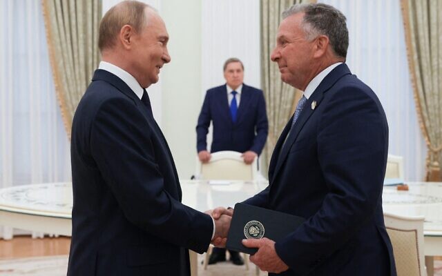 In this pool photograph distributed by the Russian state agency Sputnik, Russia's President Vladimir Putin (left) greets US Special Envoy Steve Witkoff prior to their talks in Moscow on August 6, 2025. (Gavriil Grigorov / POOL / AFP)