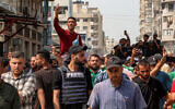 Mourners march with the bodies of the Al Jazeera journalists who were killed in an overnight Israeli strike on their tent in Gaza City, from Al-Shifa hospital to their burial at the Sheikh Radwan cemetery in Gaza City on August 11, 2025. (Omar AL-QATTAA / AFP)