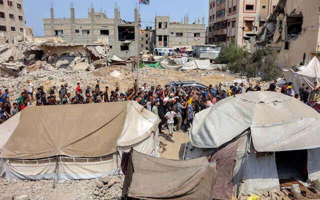 Mourners march with the bodies of the Al Jazeera journalists who were killed in an overnight Israeli strike on a tent in Gaza City on August 11, 2025. (Omar AL-QATTAA / AFP)