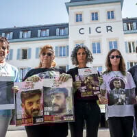 (L-R) Meirav Gilboa-Dalal, mother of hostage Guy Gilboa-Dalal); Sylvia Cunio, mother of hostage David and Ariel Cunio; Viki Cohen, mother of hostage Nimrod Cohen; and Galia and Yeela David, respectively the mother and sister of hostage Evyatar David, pose holding photographs of their loved one after attending a meeting with the president of the International Committee of the Red Cross (ICRC) at the organization's headquarters in Geneva, Switzerland, on August 12, 2025. (Fabrice COFFRINI / AFP)