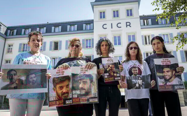 (L-R) Meirav Gilboa-Dalal, mother of hostage Guy Gilboa-Dalal); Sylvia Cunio, mother of hostage David and Ariel Cunio; Viki Cohen, mother of hostage Nimrod Cohen; and Galia and Yeela David, respectively the mother and sister of hostage Evyatar David, pose holding photographs of their loved one after attending a meeting with the president of the International Committee of the Red Cross (ICRC) at the organization's headquarters in Geneva, Switzerland, on August 12, 2025. (Fabrice COFFRINI / AFP)