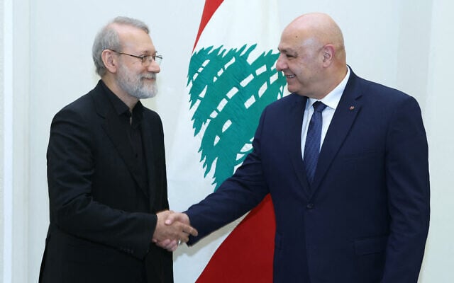 In this handout picture released by the Lebanese presidency, Lebanon's President Joseph Aoun (R) meets with Iran's head of the National Security Council Ali Larijani and a delegation at the Presidential Palace in Baabda on August 13, 2025.  (Photo by Lebanese Presidency / AFP)