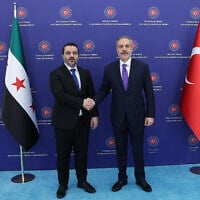 Turkish Foreign Minister Hakan Fidan (R) meeting with Syrian Foreign Minister Asaad al-Shaibani in Ankara on August 13, 2025. (TURKISH FOREIGN MINISTRY / AFP)