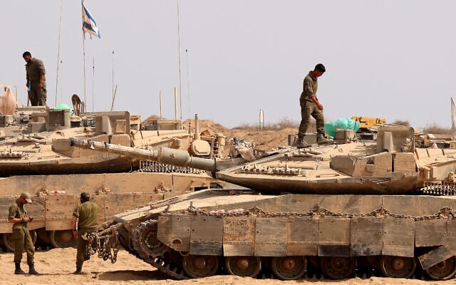 Israeli troops deploy at the border with the Gaza Strip, on August 13, 2025 (Photo by Jack GUEZ / AFP)