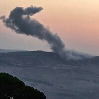 A picture taken from the southern Lebanese village of Marjayoun, shows smoke rising from the site of an Israeli airstrike that targeted the outskirts of the village of Kfartibnit in the district of Nabatieh on August 15, 2025. (Photo by Rabih DAHER / AFP)