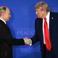 US President Donald Trump (R) and Russian President Vladimir Putin shake hands at the end of a joint press conference after participating in a US-Russia summit on Ukraine at Joint Base Elmendorf-Richardson in Anchorage, Alaska, on August 15, 2025. (Drew Angerer/AFP)
