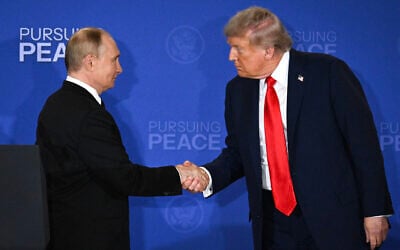US President Donald Trump (R) and Russian President Vladimir Putin shake hands at the end of a joint press conference after participating in a US-Russia summit on Ukraine at Joint Base Elmendorf-Richardson in Anchorage, Alaska, on August 15, 2025. (Drew Angerer/AFP)