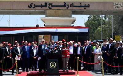 Palestinian Authority Prime Minister Mohammad Mustafa (C-L) listens as Egypt's Foreign Minister Badr Abdelatty (C) speaks at a press conference on the Egyptian side of the Rafah border crossing in Rafah on August 18, 2025.  (Photo by Khaled DESOUKI / AFP)