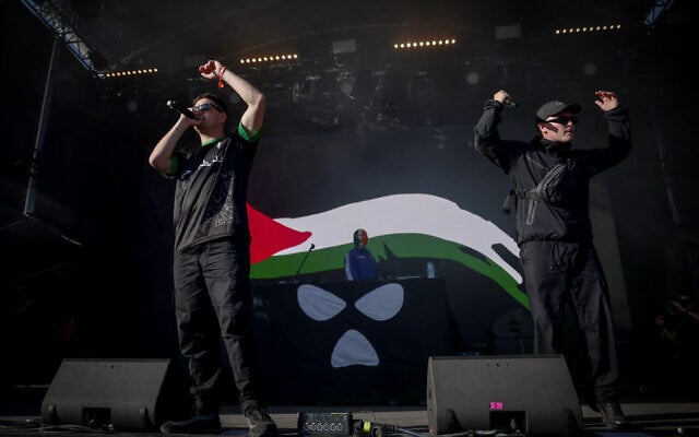 Pro-Palestinian, anti-Israel Northern Ireland hip-hop trio Kneecap perform on stage at the Rock en Seine music festival, in Saint-Cloud, near Paris, France, on August 24, 2025. (Guillaume BAPTISTE / AFP) Pro-Palestinian, anti-Israel Northern Ireland hip-hop trio Kneecap perform on stage at the Rock en Seine music festival, in Saint-Cloud, near Paris, France, on August 24, 2025. (Guillaume BAPTISTE / AFP)