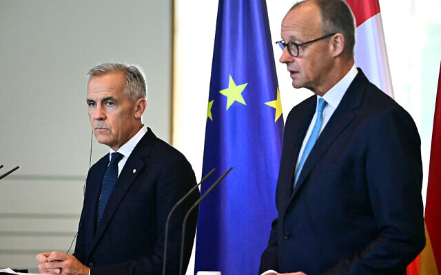 German Chancellor Friedrich Merz (R) and Canada's Prime Minister Mark Carney hold a joint press conference after bilateral talks at the Chancellery on August 26, 2025 in Berlin. (Tobias Schwarz/AFP) German Chancellor Friedrich Merz (R) and Canada's Prime Minister Mark Carney hold a joint press conference after bilateral talks at the Chancellery on August 26, 2025 in Berlin. (Tobias Schwarz/AFP)