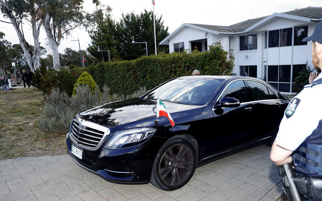 A car with the Iranian national flag leaves the Iranian embassy premises in Canberra on August 26, 2025. (Hilary Wardhaugh / AFP)
