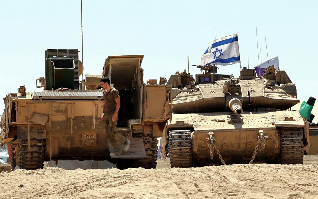 Israeli armored vehicles are positioned near the border with the Gaza Strip in southern Israel on August 27, 2025. (Jack GUEZ / AFP)