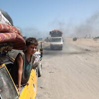 Displaced Palestinians flee Gaza City toward the southern areas of the Gaza Strip, in Nuseirat, on August 28, 2025. (Eyad BABA / AFP)