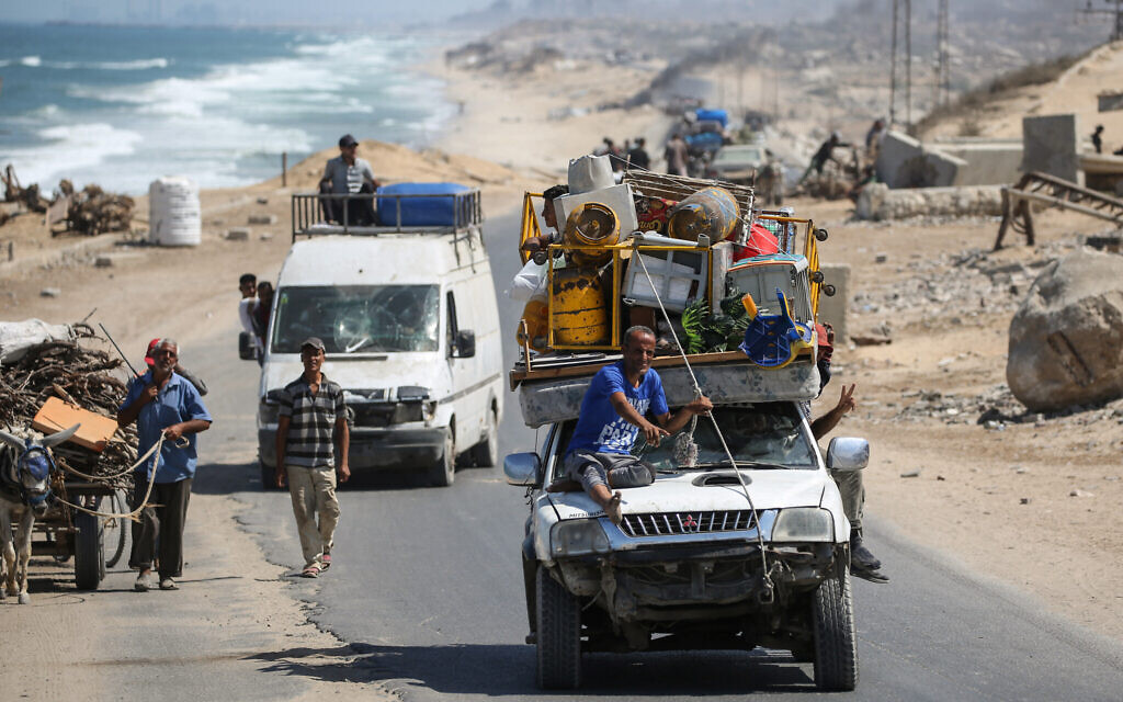 Displaced Palestinians flee Gaza City toward the southern areas of the Gaza Strip, in Nuseirat, on August 28, 2025.(Eyad Baba/AFP)