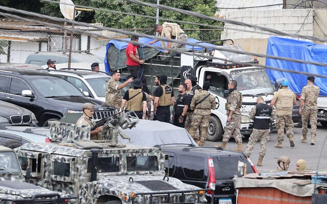Lebanese army soldiers load boxes of weapons handed over by Palestinian groups onto trucks at the Burj al-Barajneh camp in Beirut's southern suburbs on August 29, 2025. (ANWAR AMRO / AFP) Lebanese army soldiers load boxes of weapons handed over by Palestinian groups onto trucks at the Burj al-Barajneh camp in Beirut's southern suburbs on August 29, 2025. (ANWAR AMRO / AFP)