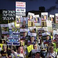Protesters lift placards during a demonstration organized by the families of hostages held in Gaza, in Tel Aviv on August 30, 2025. (Jack GUEZ / AFP)