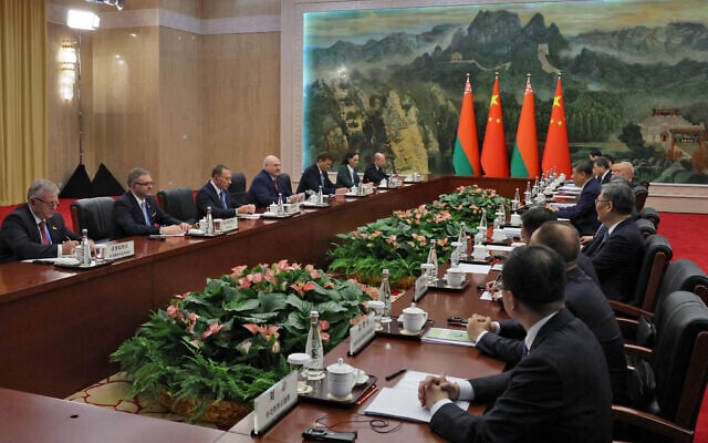 In this handout picture taken and released by the Belarusian presidential press service on August 31, 2025, Belarus' President Alexander Lukashenko meets with Chinese President Xi Jinping ahead of the Shanghai Cooperation Organization (SCO) Summit in Tianjin. (Photo by Handout / Belarusian presidential press service / AFP)