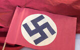 Illustrative: A swastika flag displayed in a showcase during the press preview at the new permanent exhibition of former Nazi concentration camp Buchenwald near Weimar, Germany, April 13, 2016.(AP Photo/Jens Meyer)