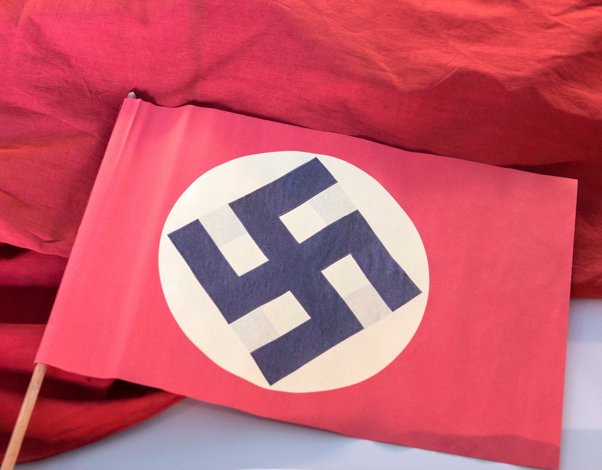 NextImg:Belgian politician apologizes after compromising photo shows him draped in Nazi flag