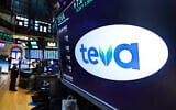 Illustrative: The logo for Teva appears above a trading post on the floor of the New York Stock Exchange, October 21, 2019. (AP Photo/Richard Drew)