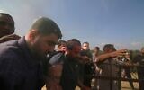 Jihad Kamal Salem Najjar (left) and other Hamas terrorists abduct Yarden Bibas to Gaza after kidnapping him from his home in Nir Oz, near the Gaza border, on October 7, 2023. (AP Photo)