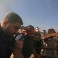 Jihad Kamal Salem Najjar (left) and other Hamas terrorists abduct Yarden Bibas to Gaza after kidnapping him from his home in Nir Oz, near the Gaza border, on October 7, 2023. (AP Photo)