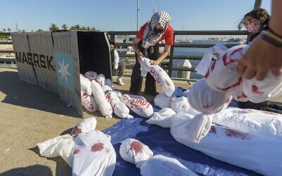 Illustrative: Members of the Palestinian Youth Movement pull effigies out of a shipping container during a protest against the shipping and logistics giant Maersk for doing business with Israel on August 28, 2024, at the Port of Los Angeles. (AP Photo/ Damian Dovarganes) Illustrative: Members of the Palestinian Youth Movement pull effigies out of a shipping container during a protest against the shipping and logistics giant Maersk for doing business with Israel on August 28, 2024, at the Port of Los Angeles. (AP Photo/ Damian Dovarganes)