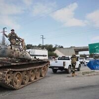 Reinforcement Syrian security forces deploy in the outskirts of Latakia, Syria, March 7, 2025. (Omar Albam/AP)