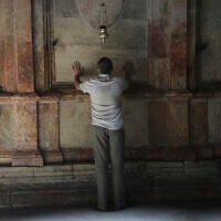 A man visits the Church of the Holy Sepulcher in the Old City of Jerusalem, Wednesday, June 11, 2025. (AP/Mahmoud Illean)