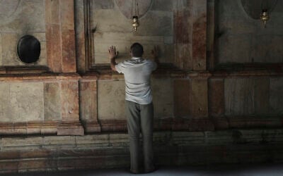A man visits the Church of the Holy Sepulcher in the Old City of Jerusalem, Wednesday, June 11, 2025. (AP/Mahmoud Illean)