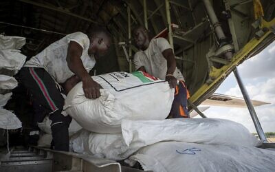 A Fogbow aid plane is loaded at an airport in Juba, South Sudan, on June 9, 2025, before conducting airdrops of food in the Upper Nile region. (AP Photo/ Florence Miettaux)
