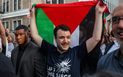 Anti-Israel, pro-Palestinian US activist Mahmoud Khalil carries a Palestinian flag during a rally celebrating his return from immigration detention, June 22, 2025, in New York. (AP Photo/Olga Fedorova)