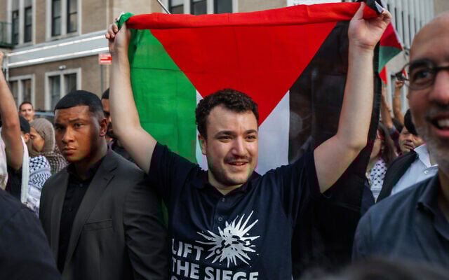 Anti-Israel, pro-Palestinian US activist Mahmoud Khalil carries a Palestinian flag during a rally celebrating his return from immigration detention, June 22, 2025, in New York. (AP Photo/Olga Fedorova)