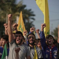 Hezbollah supporters wave Hezbollah flags and chant slogans during a gathering outside the Iranian Embassy in Beirut, Lebanon, on June 25, 2025, to honor the Islamic Republic of Iran for what organizers described as "breaking American and Israeli aggression." (AP Photo/Hassan Ammar)